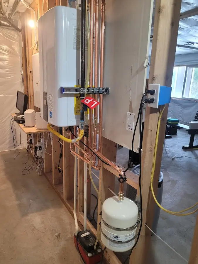 Licensed plumber repairing a kitchen sink in Burlington