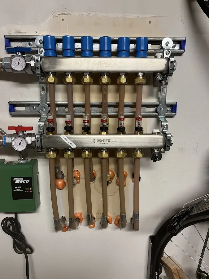 Plumber performing Water Heater Repair at a residential property in Burlington